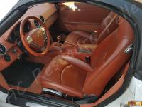 Porsche Boxster (987) - anno 2007 - Pulizia interno in pelle e restauro plastiche - Panoramica dell'abitacolo lato guida. (PRIMA)