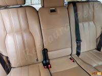 Range Rover Vogue TDV8 (L322) - anno 2008 - Restauro completo dell’interno in pelle e delle plastiche  - Panoramica dello schienale del divano posteriore. (PRIMA)