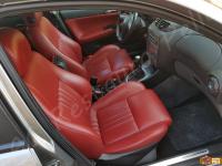 Alfa Romeo 147 - anno 2006 - Restauro volante e trattamento interno in pelle  - Panoramica abitacolo lato passeggero. (PRIMA)
